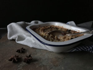 Star Anise flavourd Stollen Pudding in a white enamel dish