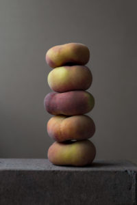 Stack offive flat peaches