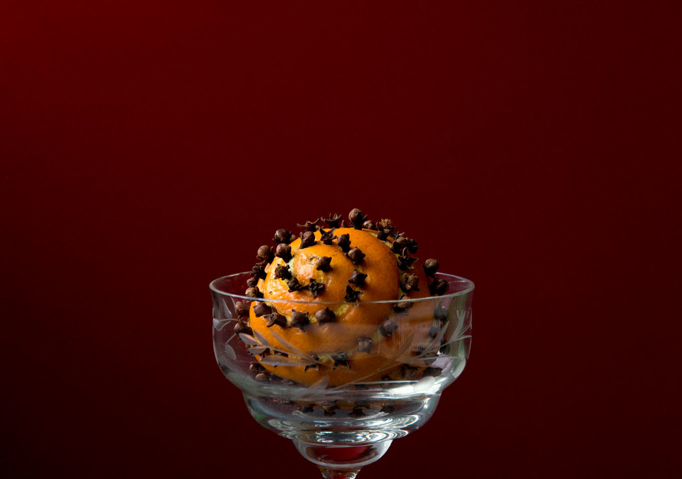 Orange pomander in a glass bowl