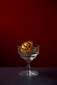 Orange pomander in a glass bowl