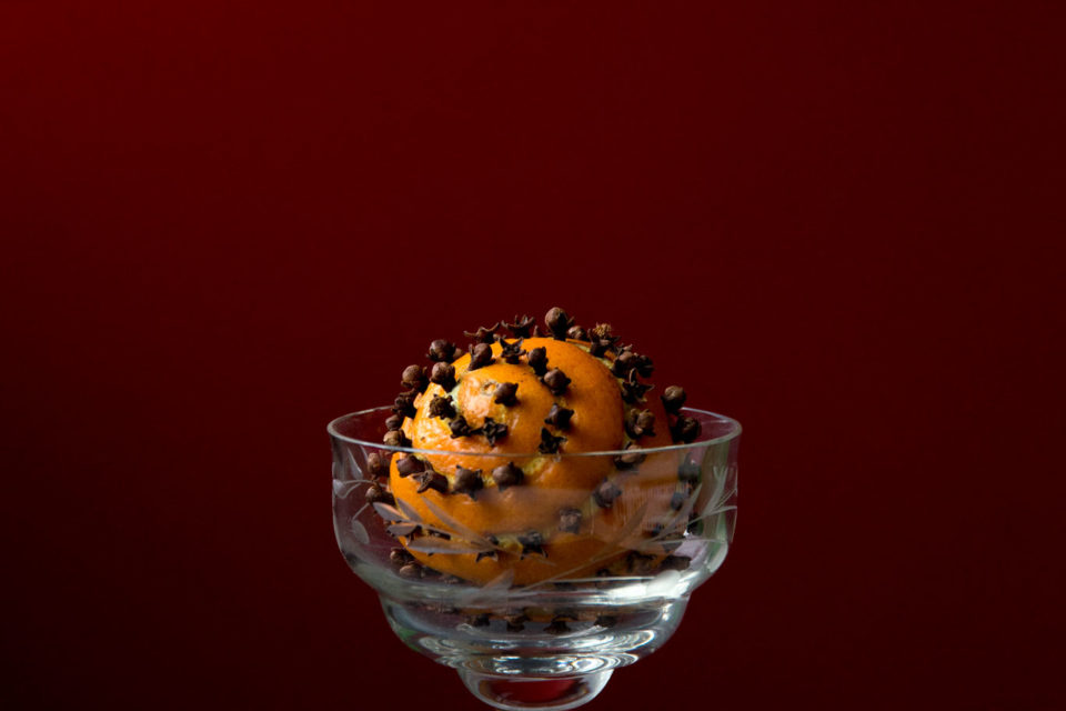 Orange pomander in a glass bowl